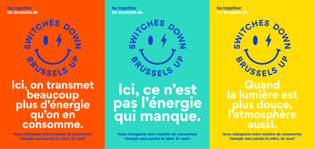 Affiches rouge, jaune et bleue avec un smiley contenant « Switches down. Brussels Up » et des slogans.